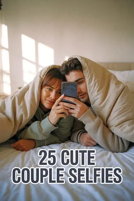 A cozy couple taking a cute selfie in soft beige bedding, relaxed and smiling with warm morning light.