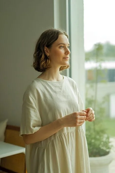 Woman posing indoors for a 30th birthday photoshoot.