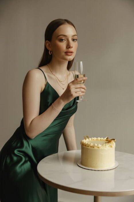 classy champagne 21st birthday photoshoot with satin dress and gold details
