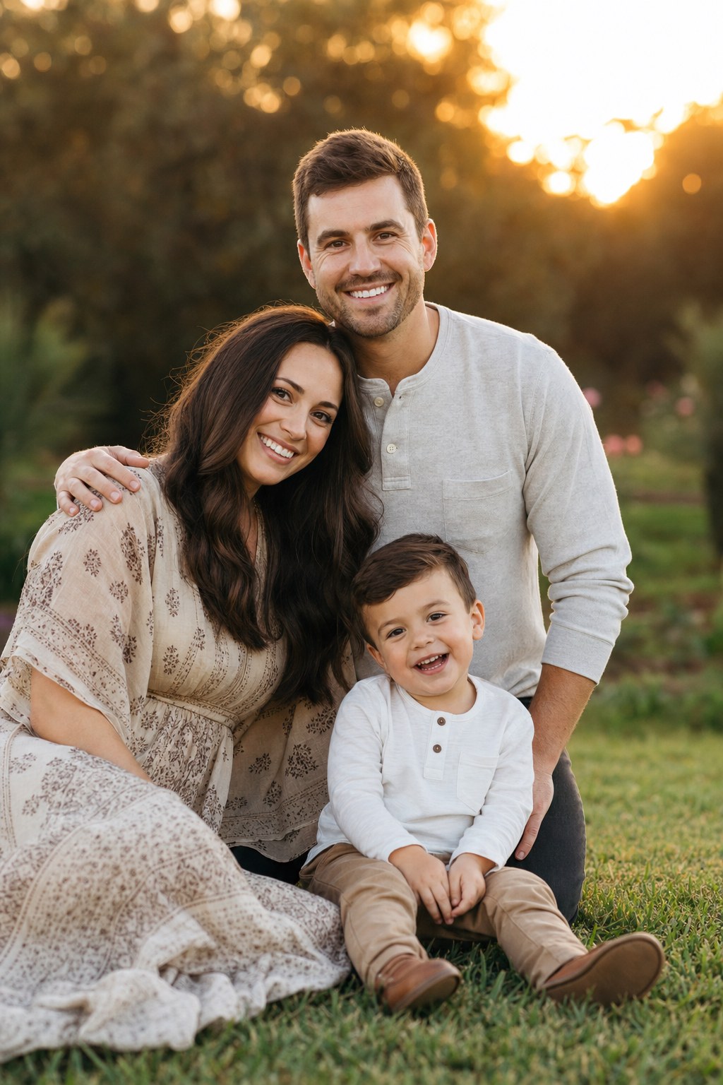 Family of 3 triangle stack pose &mdash; parents and toddler in golden hour outdoor setting