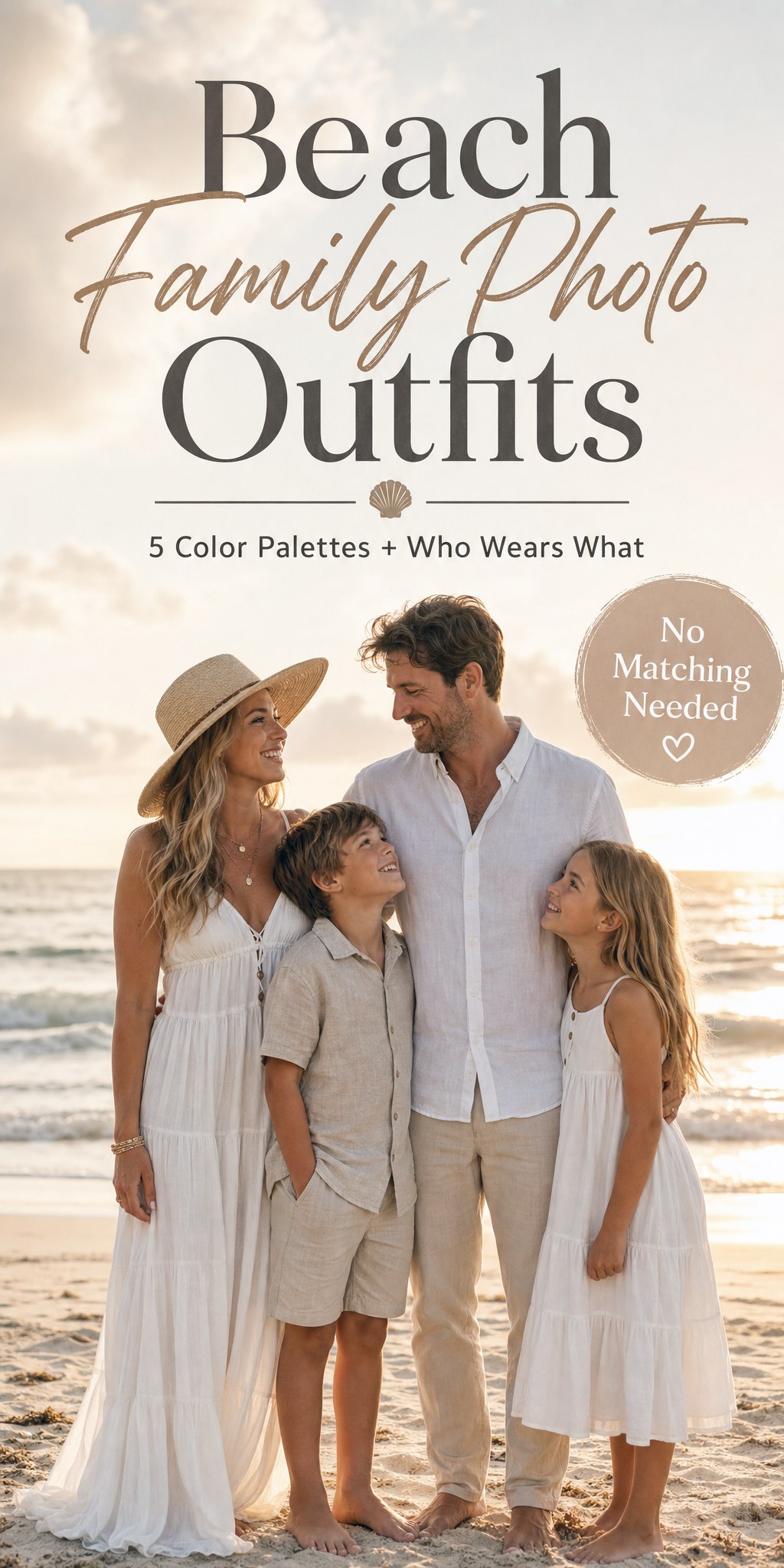 Family of four in coordinated neutral and white beach outfits on the sand at golden hour